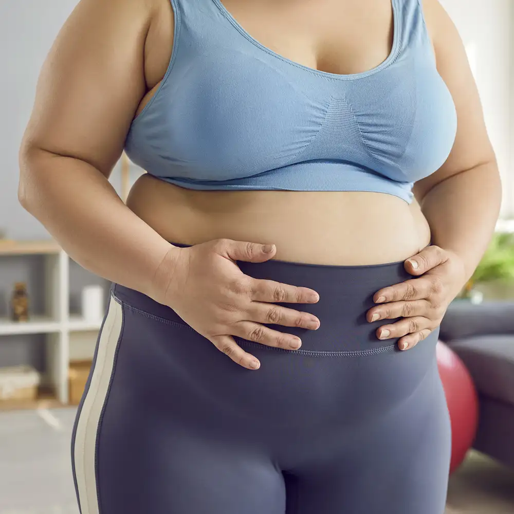 Woman experiencing perimenopause-related weight changes